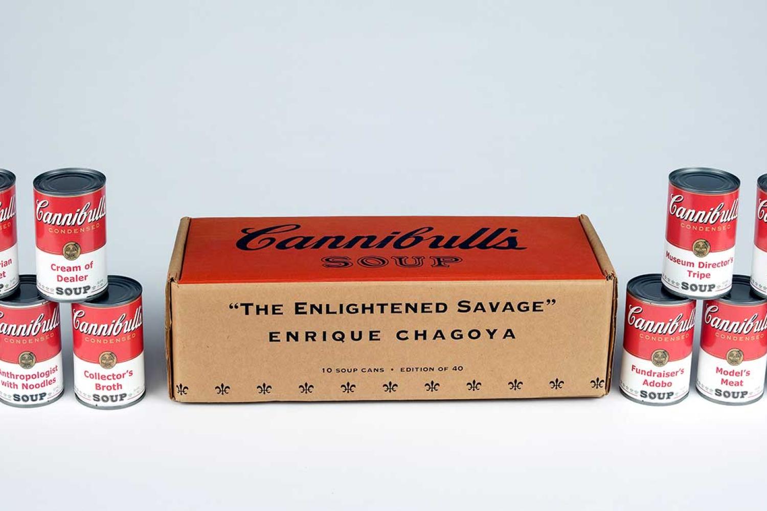 cans designed to look like Campbell's soup cans are stacked and labeled with ironic labels, and flank a box.