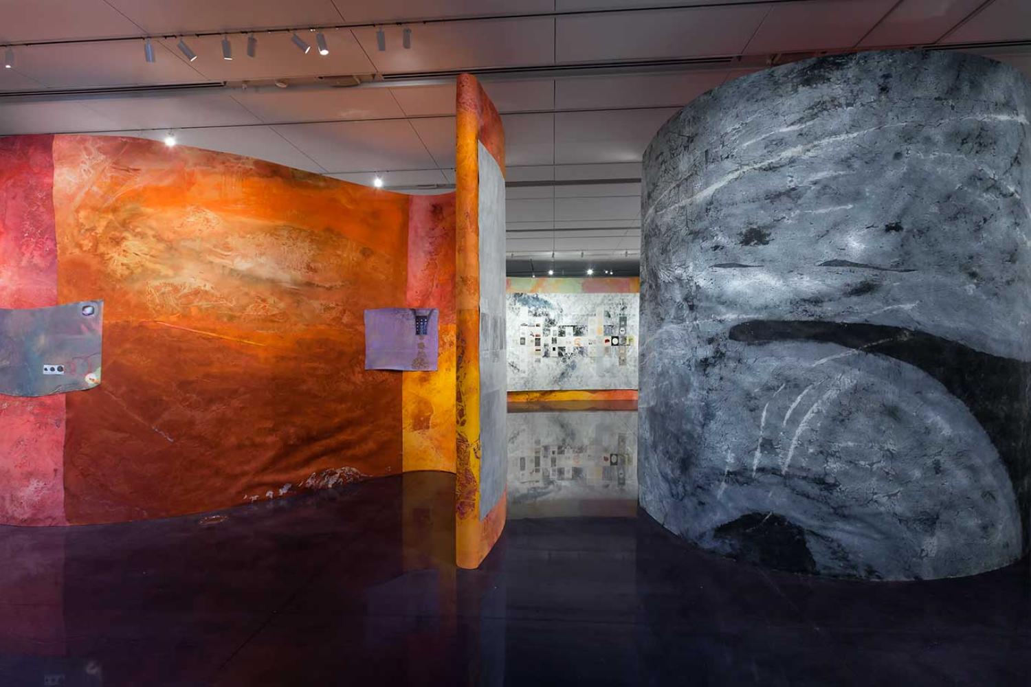 Installation view of large curved walls