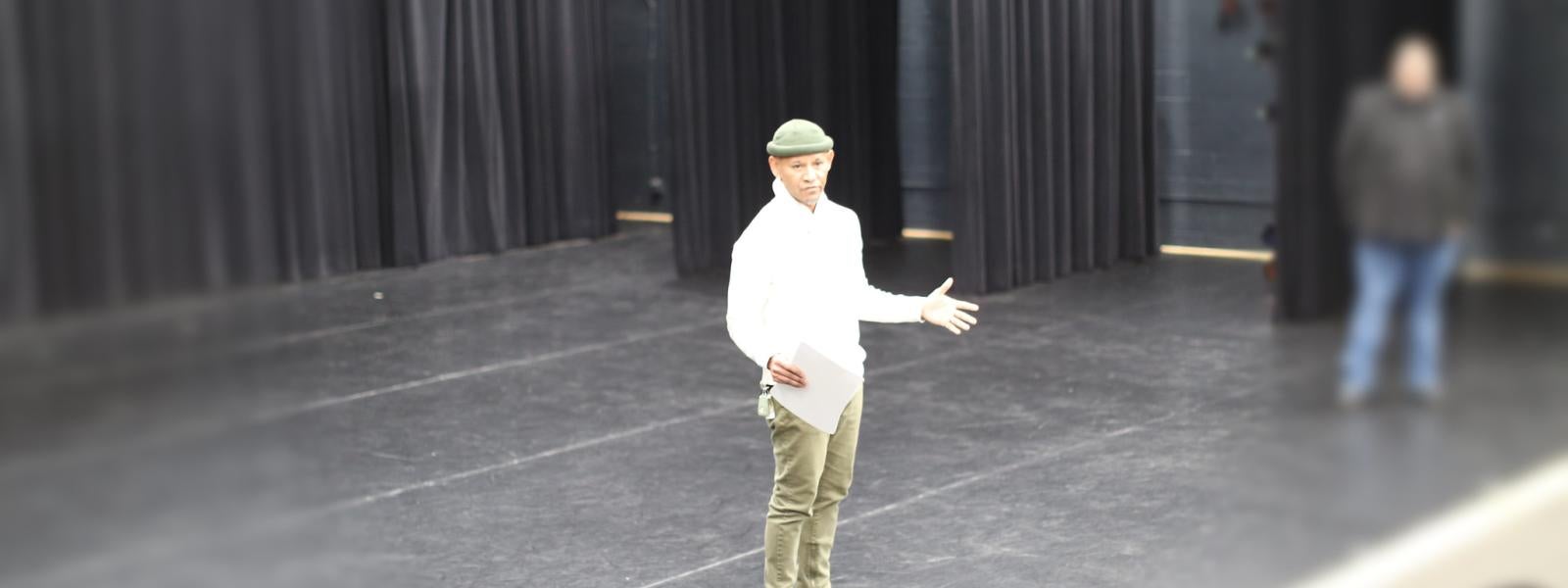 Teacher presenting on stage