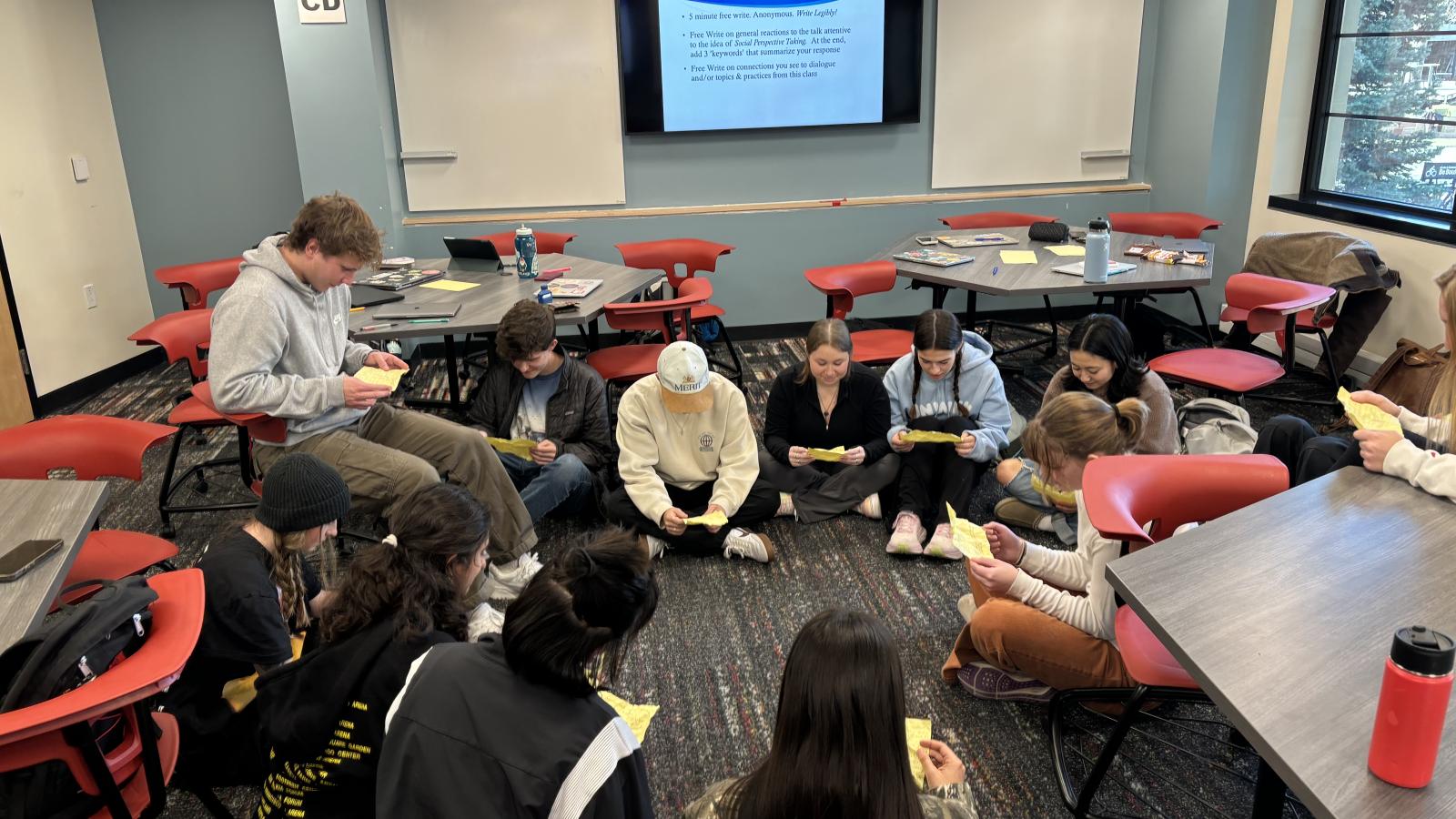 Dialogues across difference course sitting in circle on floor