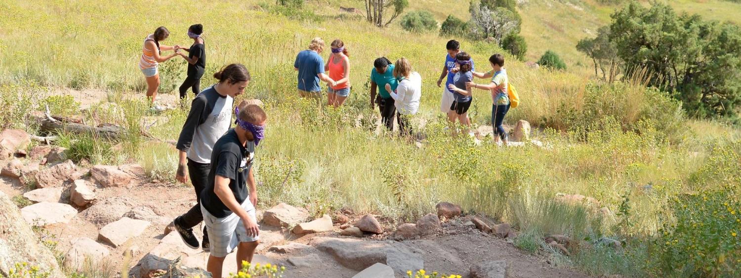 Puksta students in outdoor trust building activity