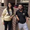 Two CU students in University of Colorado shirts, smiling
