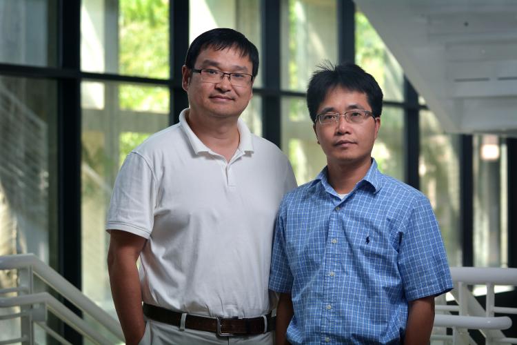 The research team, led by Principal Investigator Ronggui Yang (right) and Co-Principle Investigator Xiaobo Yin (left)