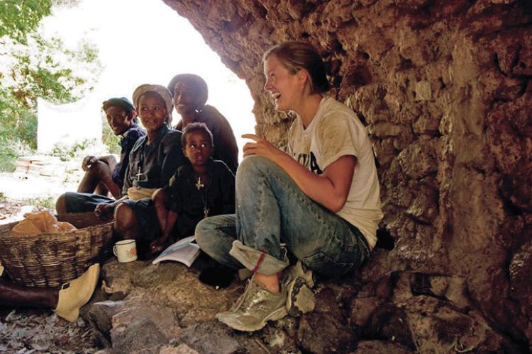 Avery laughing with children in Ethiopia 