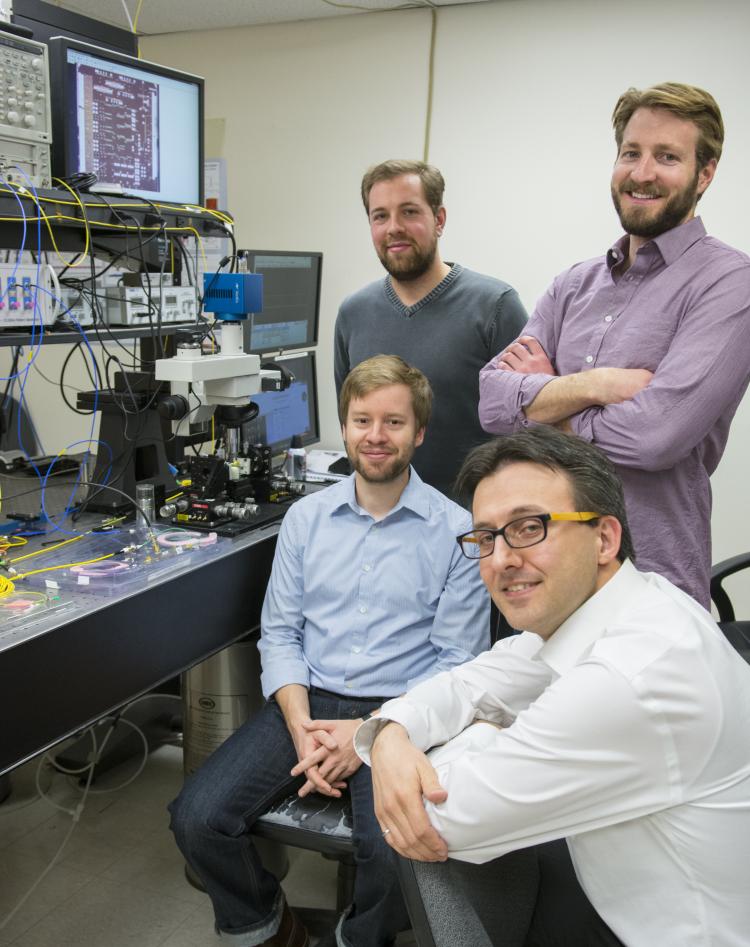 Milos Popovic and doctoral candidates, Mark Wade, Jeff Shainline and Fabio Pavanello