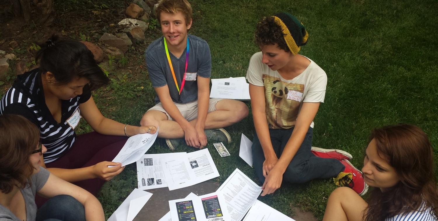 Students sitting on lawn and talking