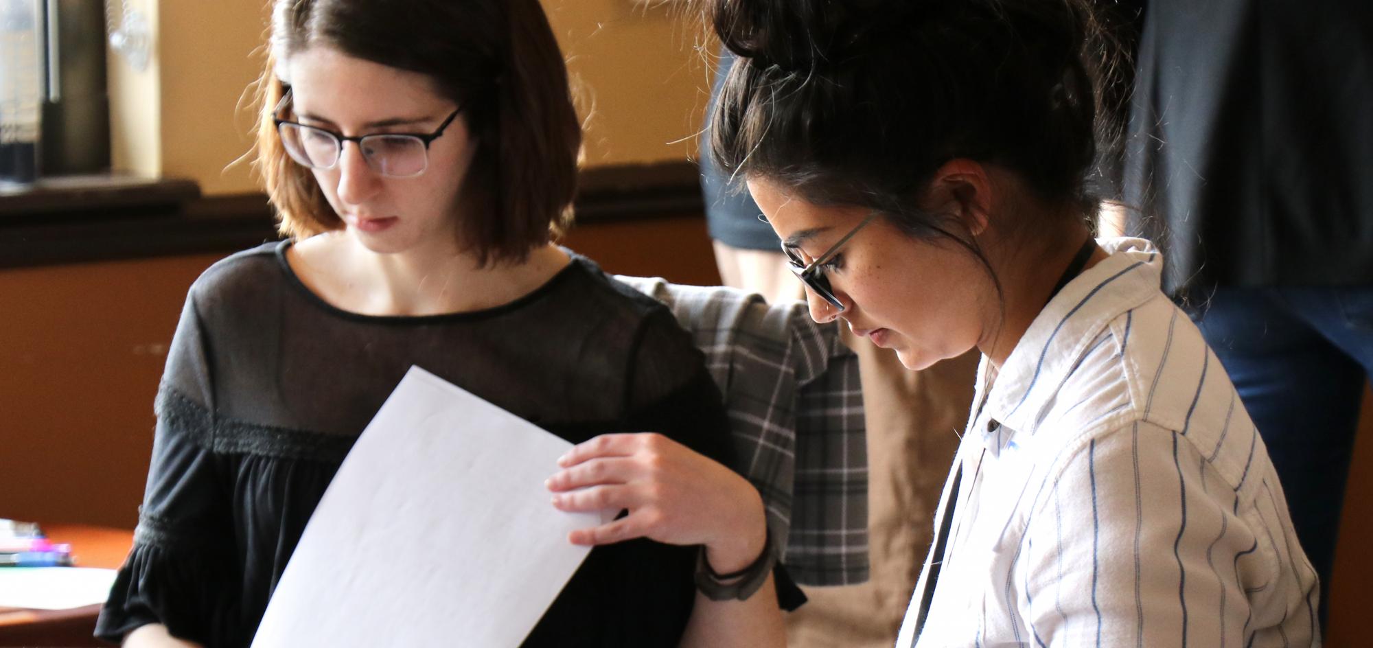 Students reviewing papers