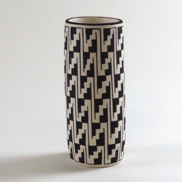 tall clay cup with black and white painted step design