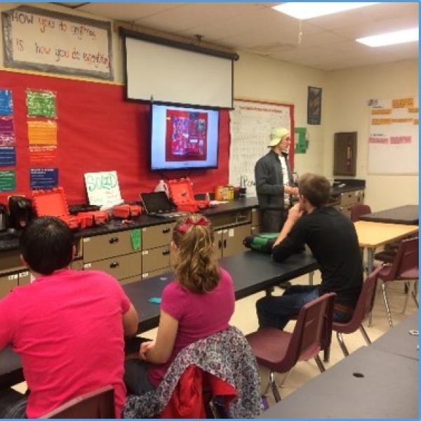 Students discussing AQ-IQ in classroom