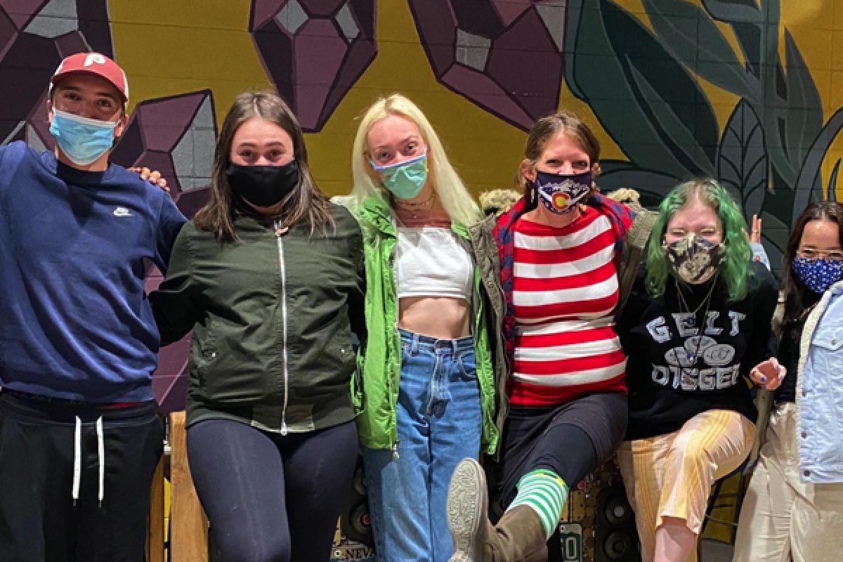 Seven students arm in arm