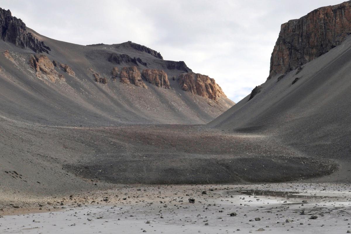 Mountains and valley with brown dirt and no snow