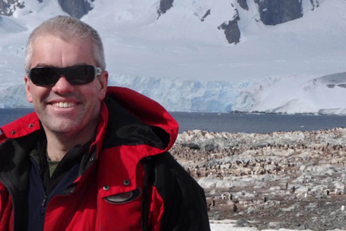 Adrian Howkins in Antarctica wearing sunglasses