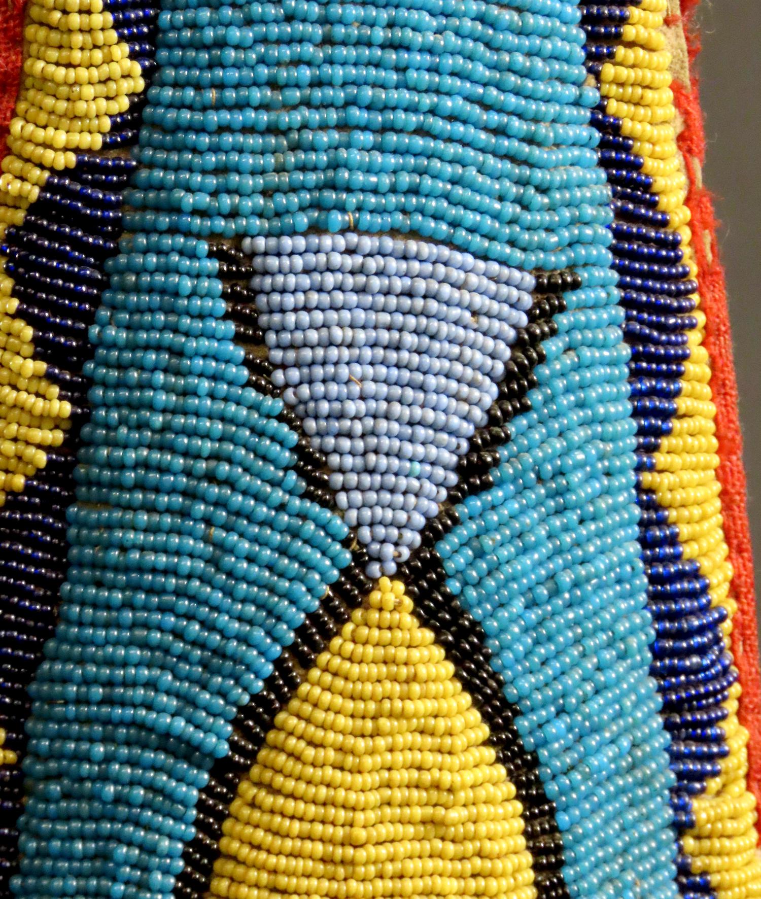 leather with beaded decoration in blue, yellow and reds