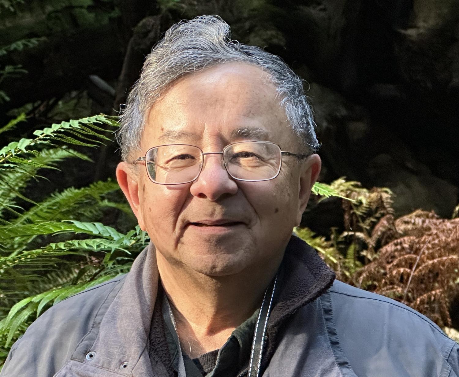 Kenneth Carpenter in front of plant