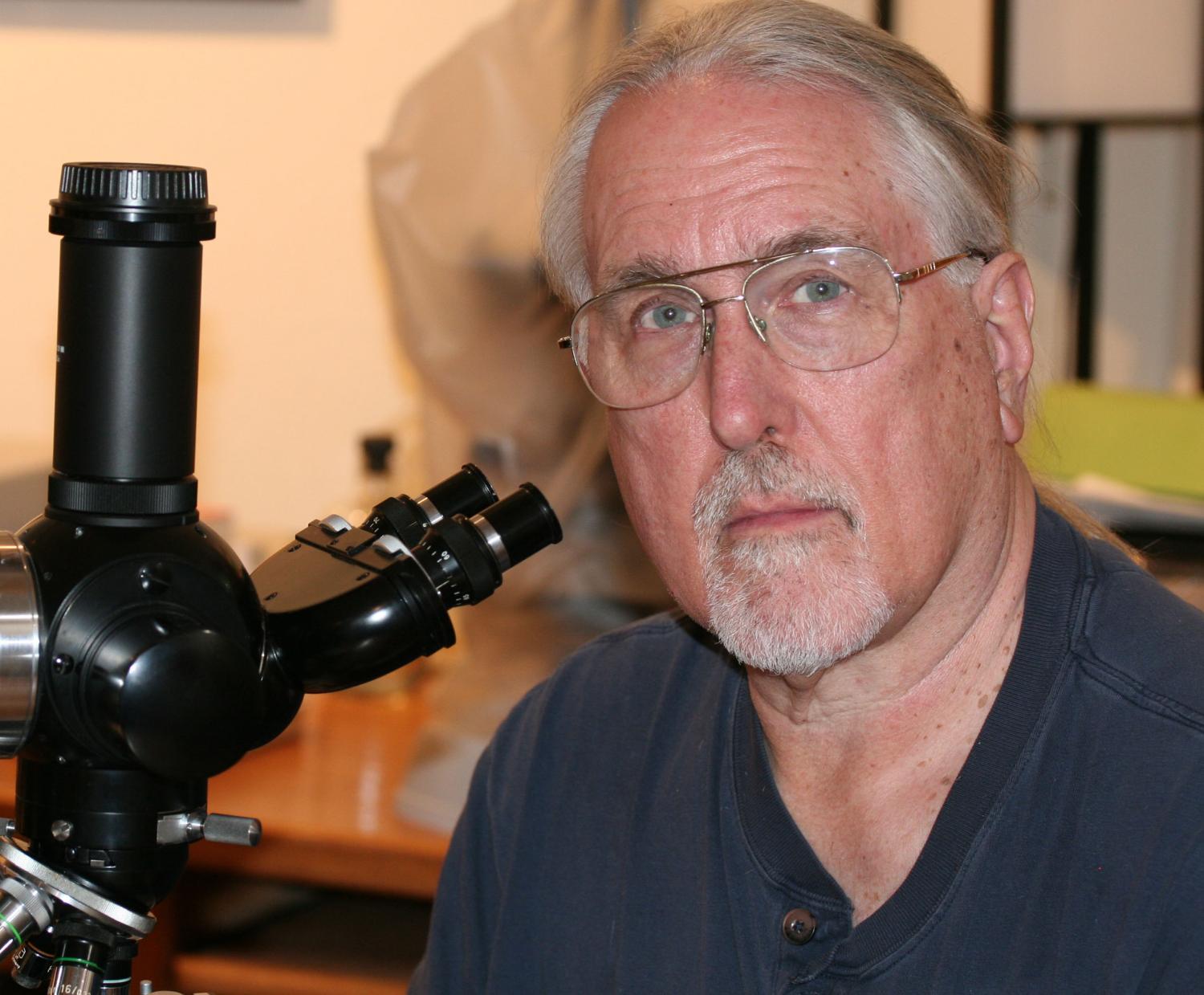 Garland Upchurch with microscope