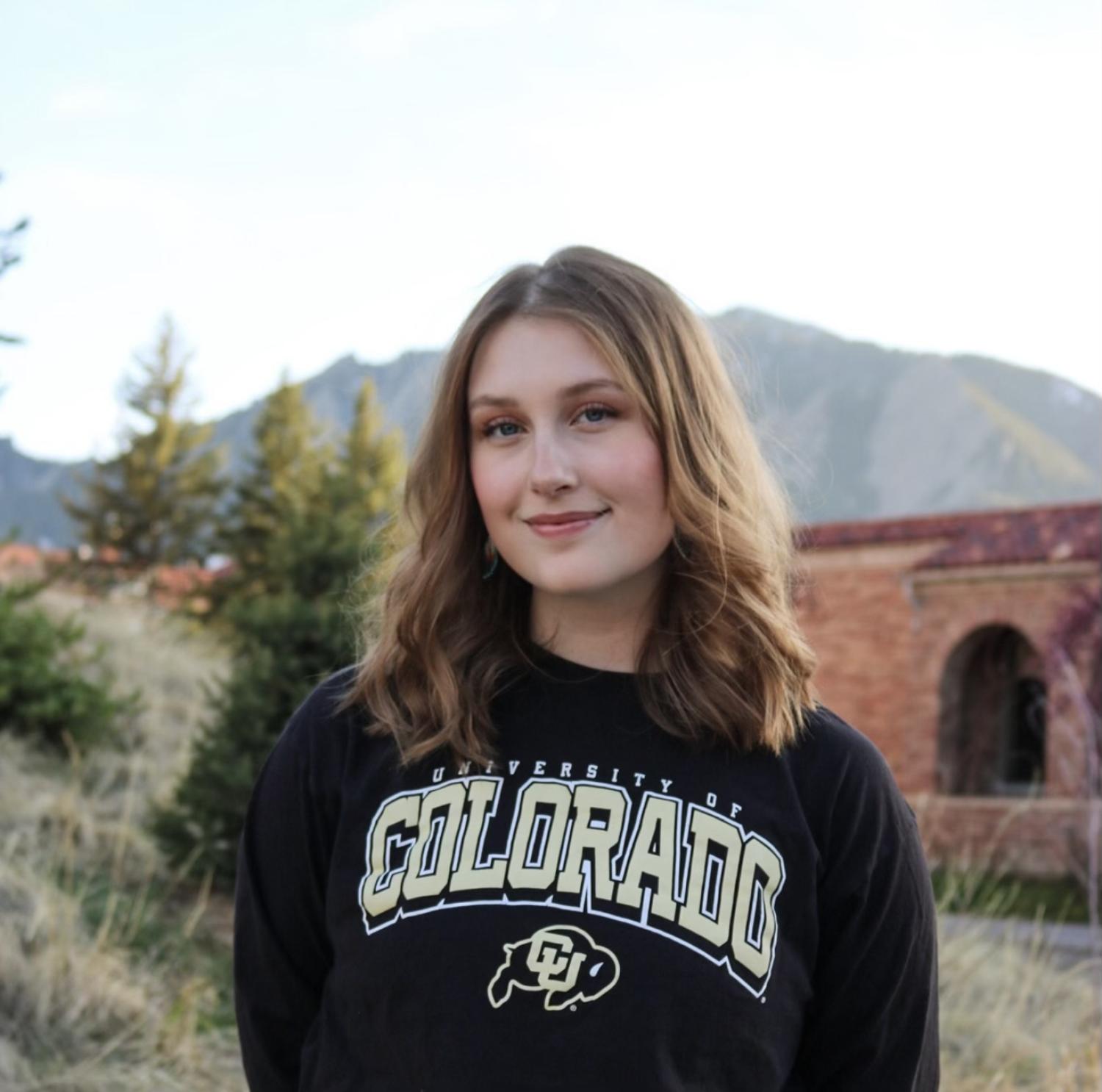 Elena Lompe outside wearing a CU Boulder sweatshirt