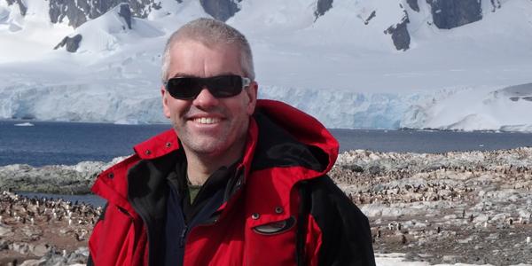 Adrian Howkins in Antarctica wearing sunglasses