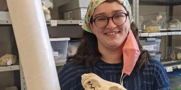 Sasha holding animal skull