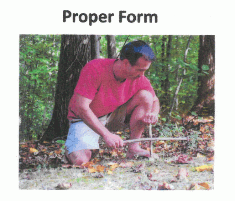 man kneeling beside hearth