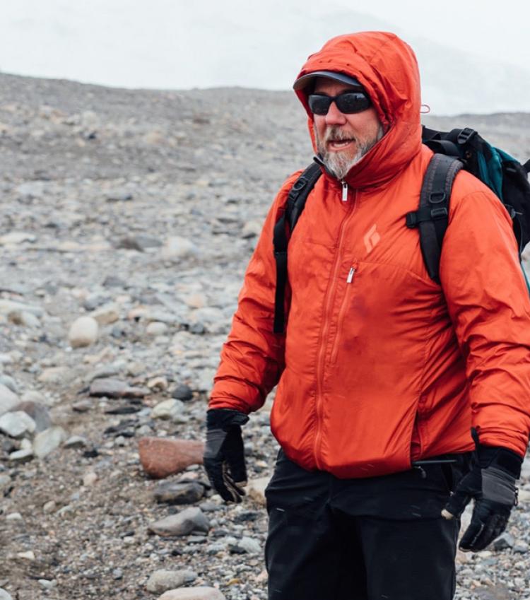 Mike Gooseff standing in dry landscape in Antarctics