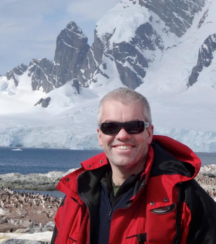 Adrian Howkins in Antarctica wearing sunglasses