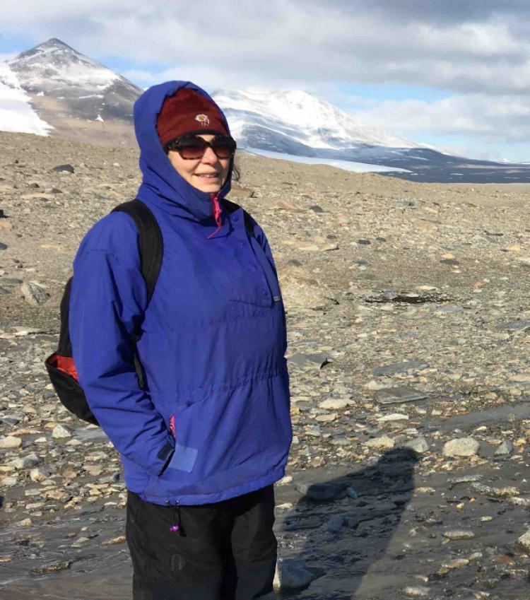 Diane McKnight in a barren landscape in Antarctica