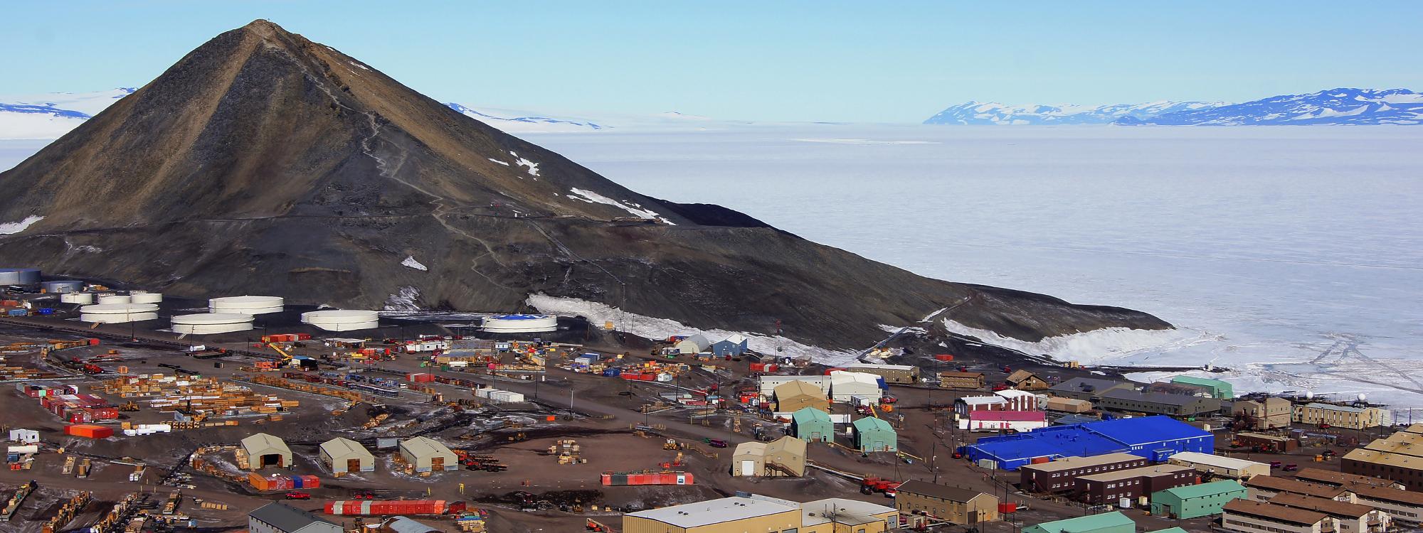 McMurdo station sitting at the base of a mountain on the bay