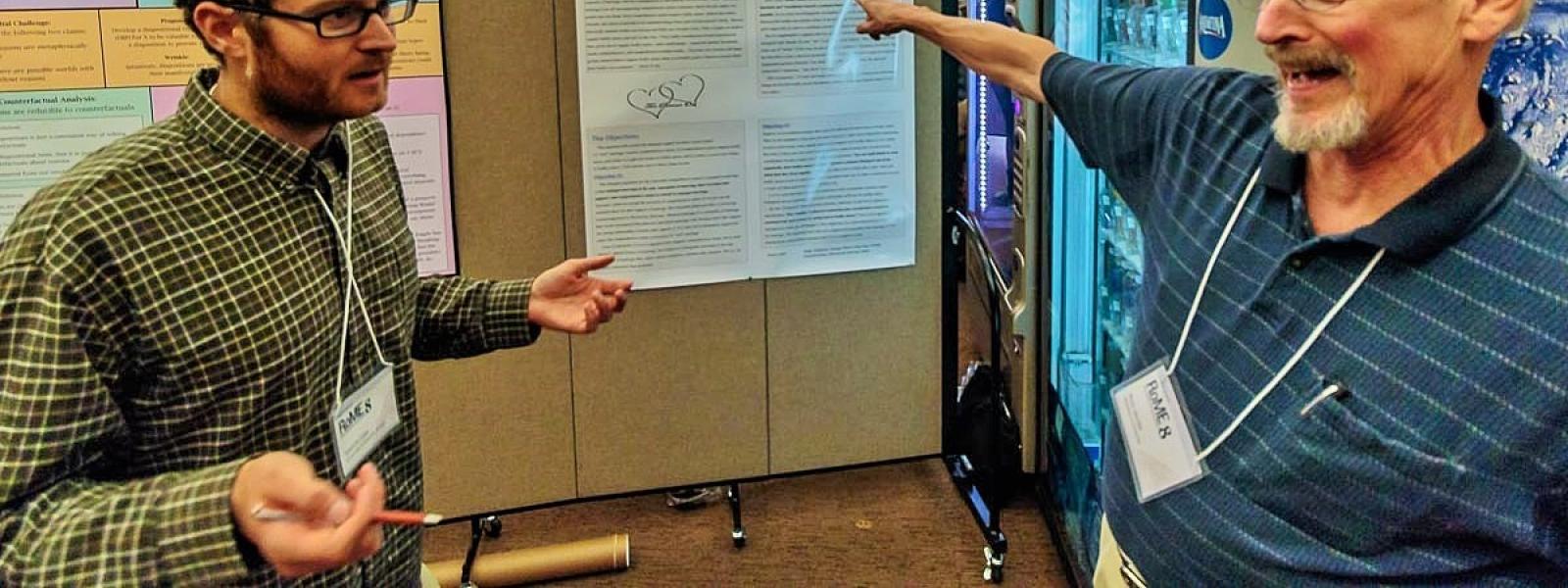 CU graduate student Spencer Case and Russ Jacobs (Washburn University) debating the nature of marriage during the poster session at CVSP’s Rocky Mountain Ethics Congress VIII