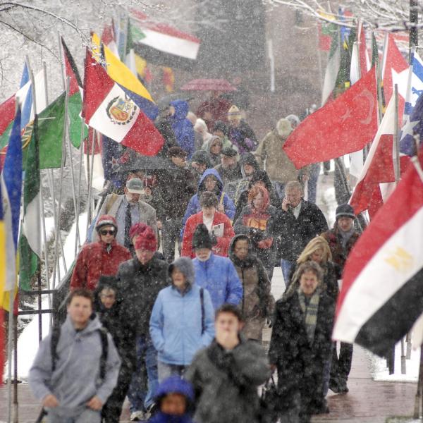 CWA attendees trudge through the snow on the CU Boulder campus