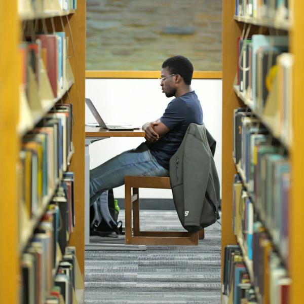 student at library