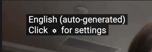 YouTube video message that reads "English (auto-generated) Click for settings"