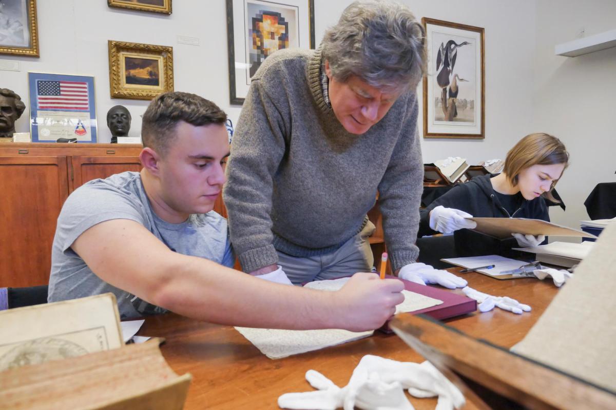 staff working with student