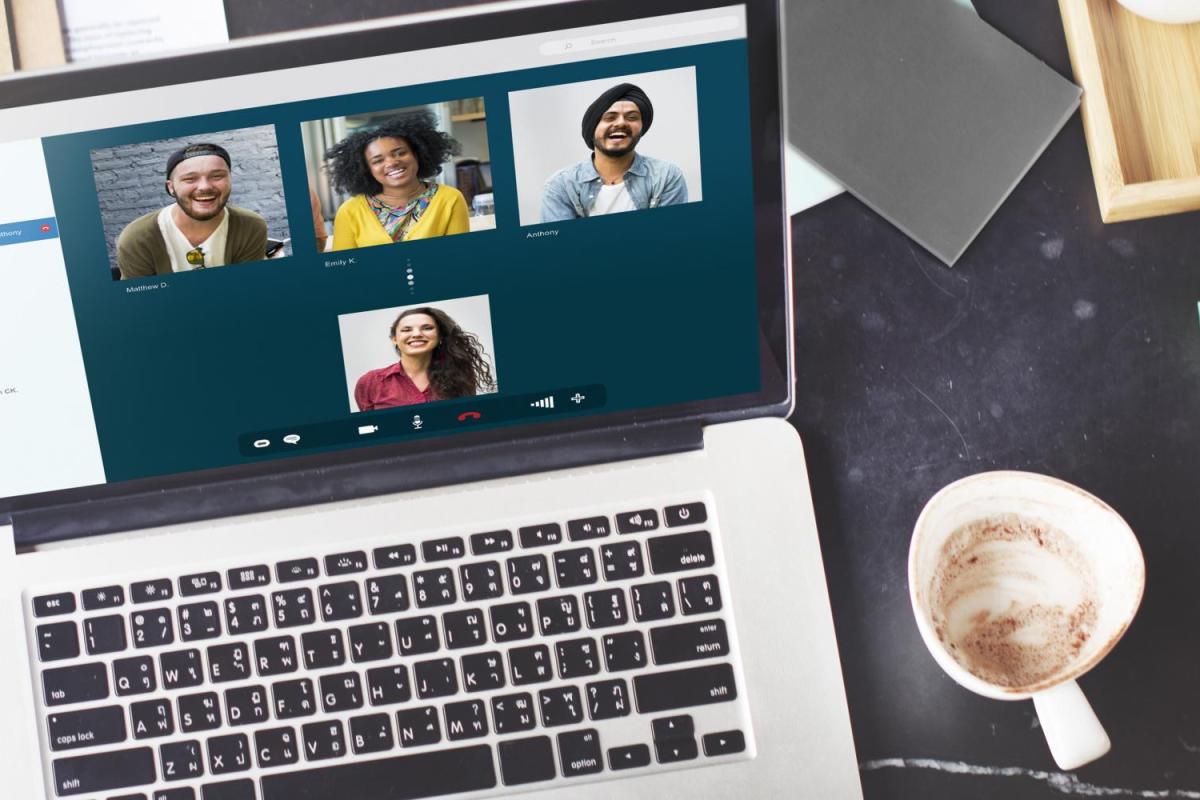 laptop open to a call with multiple people