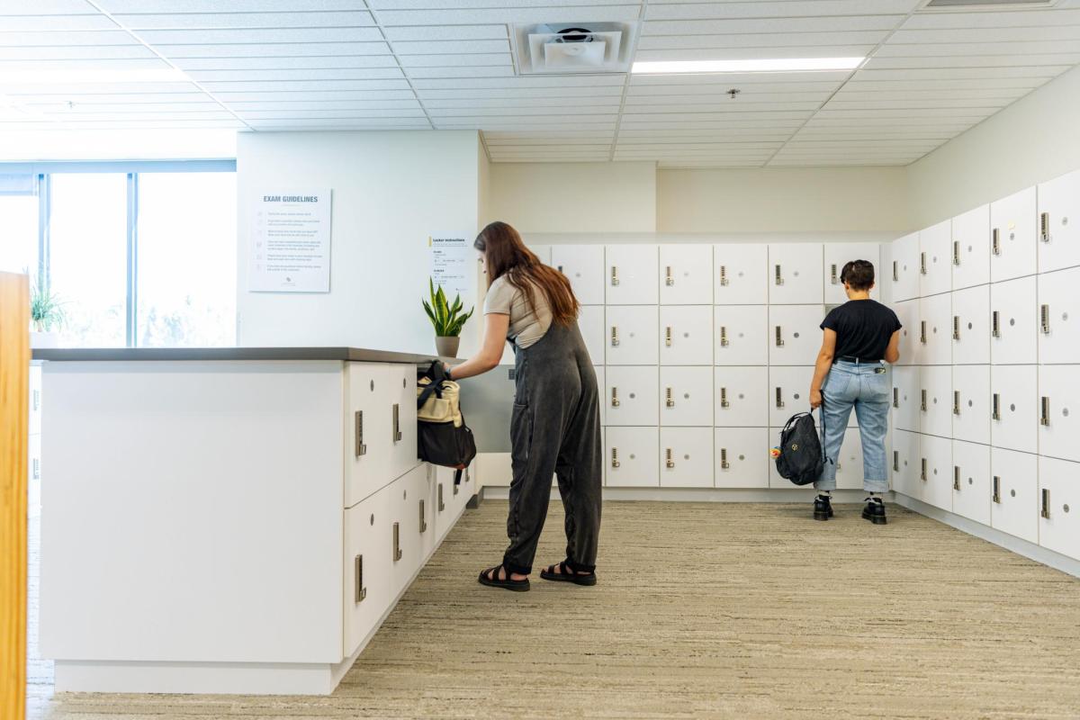 students putting belongings in lockers