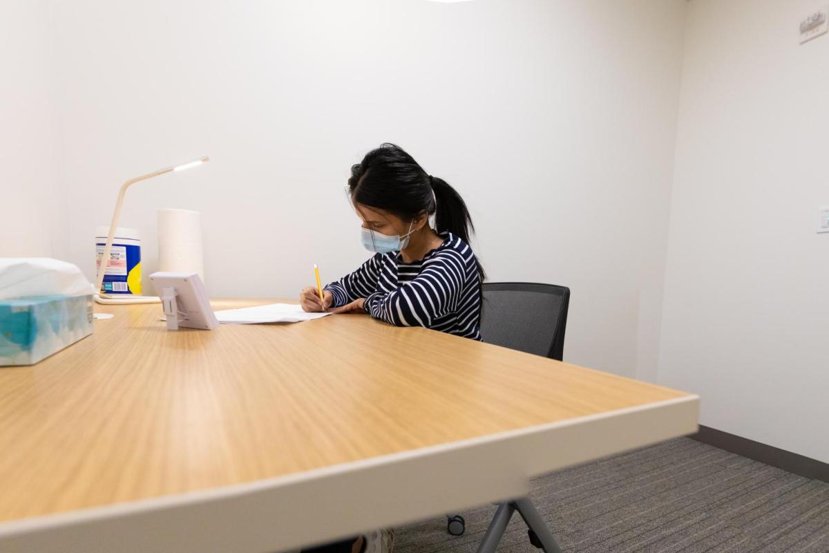student at the testing center taking a test