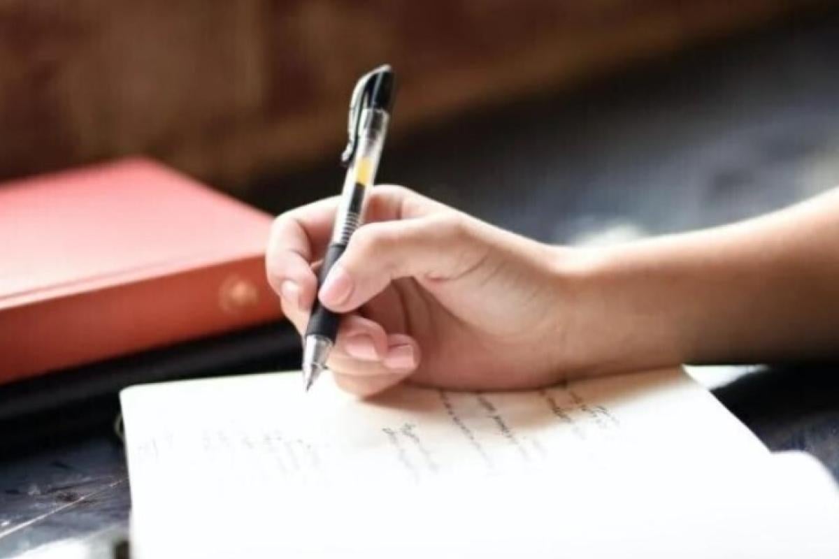 writing in notebook