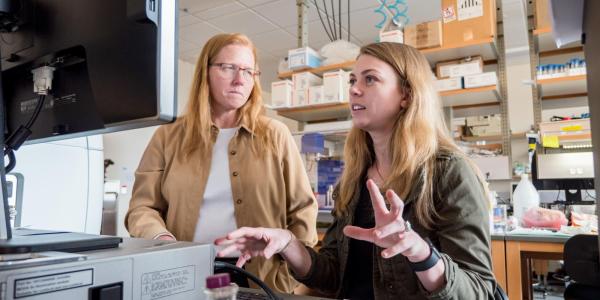 grad student and professor working in a lab