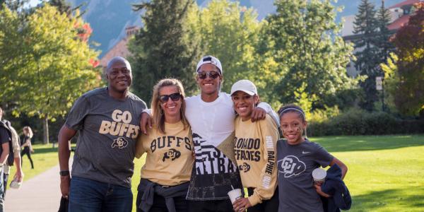 a family at CU Boulder in CU gear