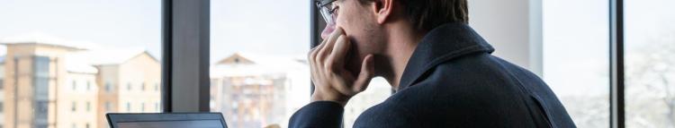 student looking at their computer