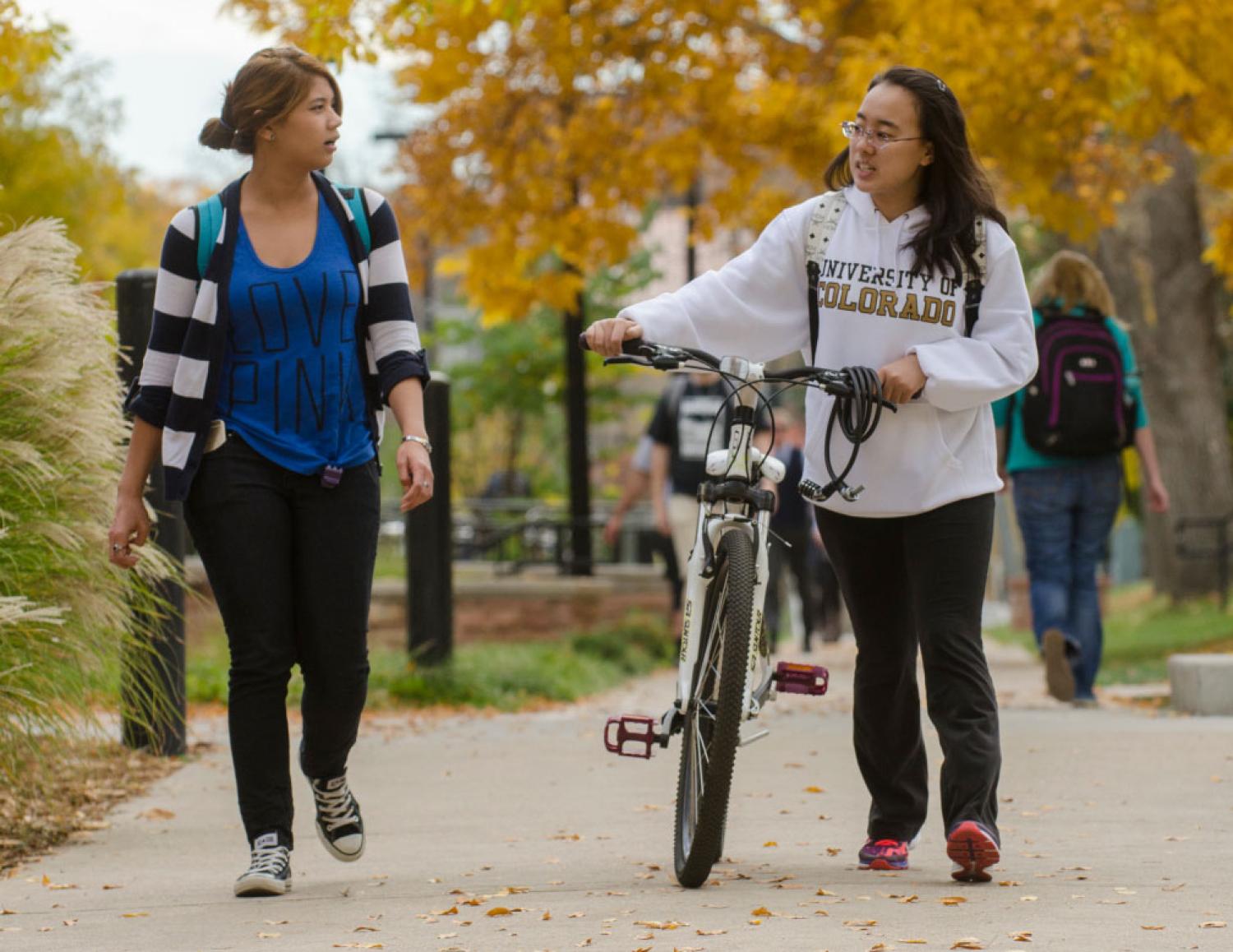 Friends walking on sidewalk