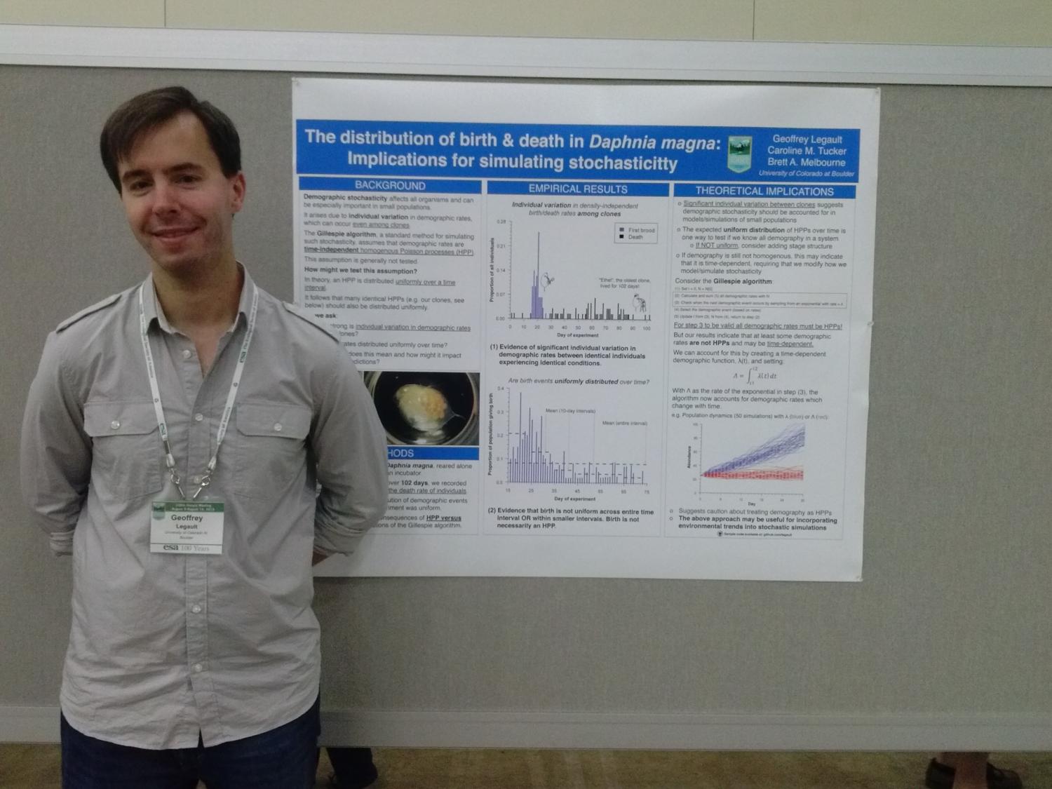 Photo of Geoff Legault in front of his poster.