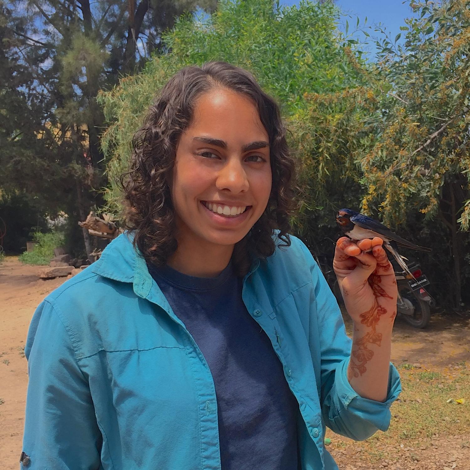 Sheela Turbek with a barn swallow.