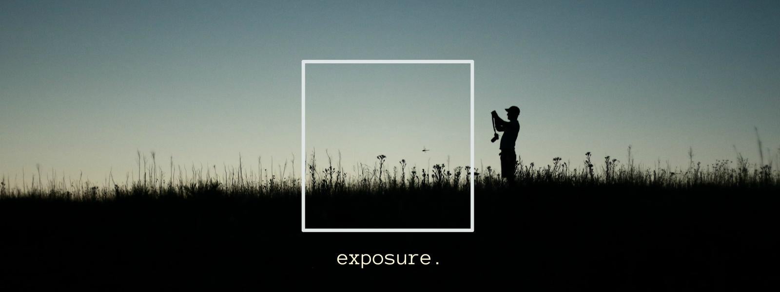 A silhouetted photographer in a grassy field is depicted in a banner for the Exposure project.