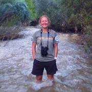 Erin Tripp standing in a river