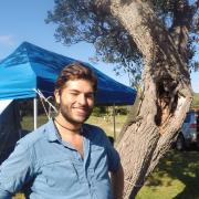 Zach enjoying a moment of shade during a day of research