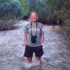 Erin Tripp standing in a river
