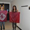 Students holding their dyed scarves.
