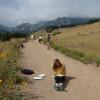 Evolution students studying sunflower seeds in front of the Flatirons