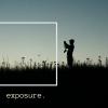 The silhouette of a photographer stands in a field of tall grass captioned with "exposure."