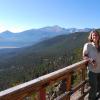 Orlofske standing on bridge overlooking mountain view
